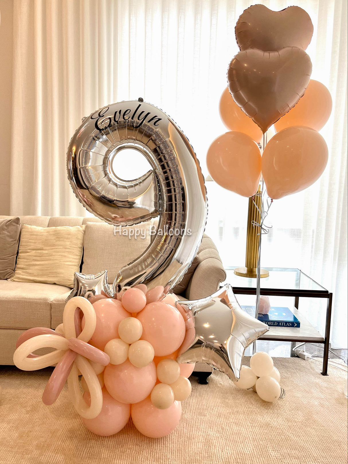 Decorative balloons with numbers and names in a living room setting