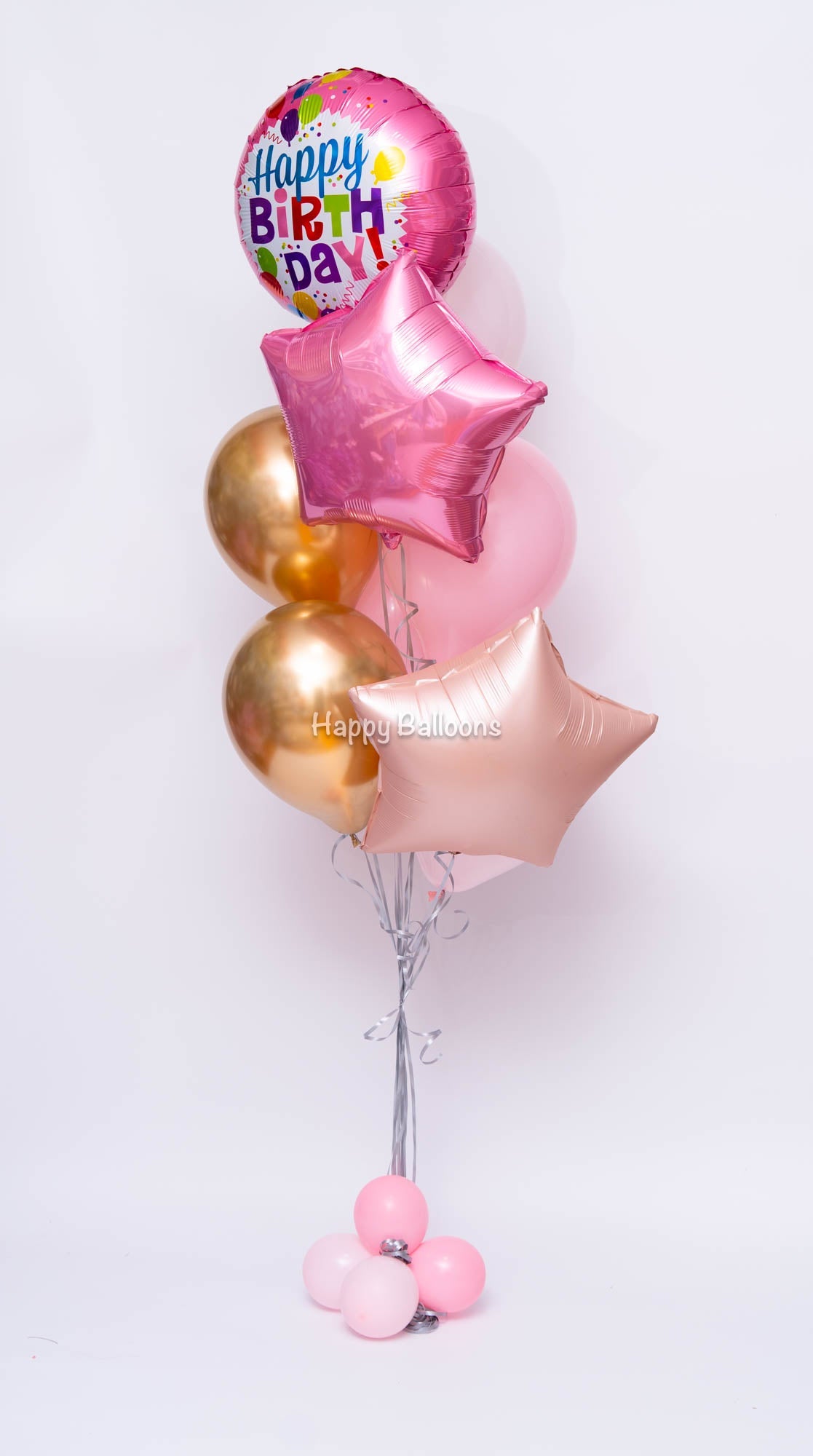 Pink and gold latex and foil Happy Birthday helium bouquet photographed for Happy Balloons