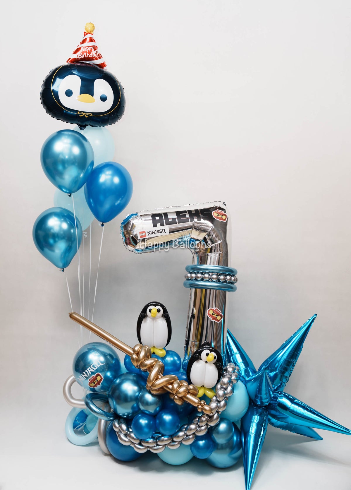 Penguin-themed number 7 balloon set with blue and silver balloon details prepared by Happy Balloons