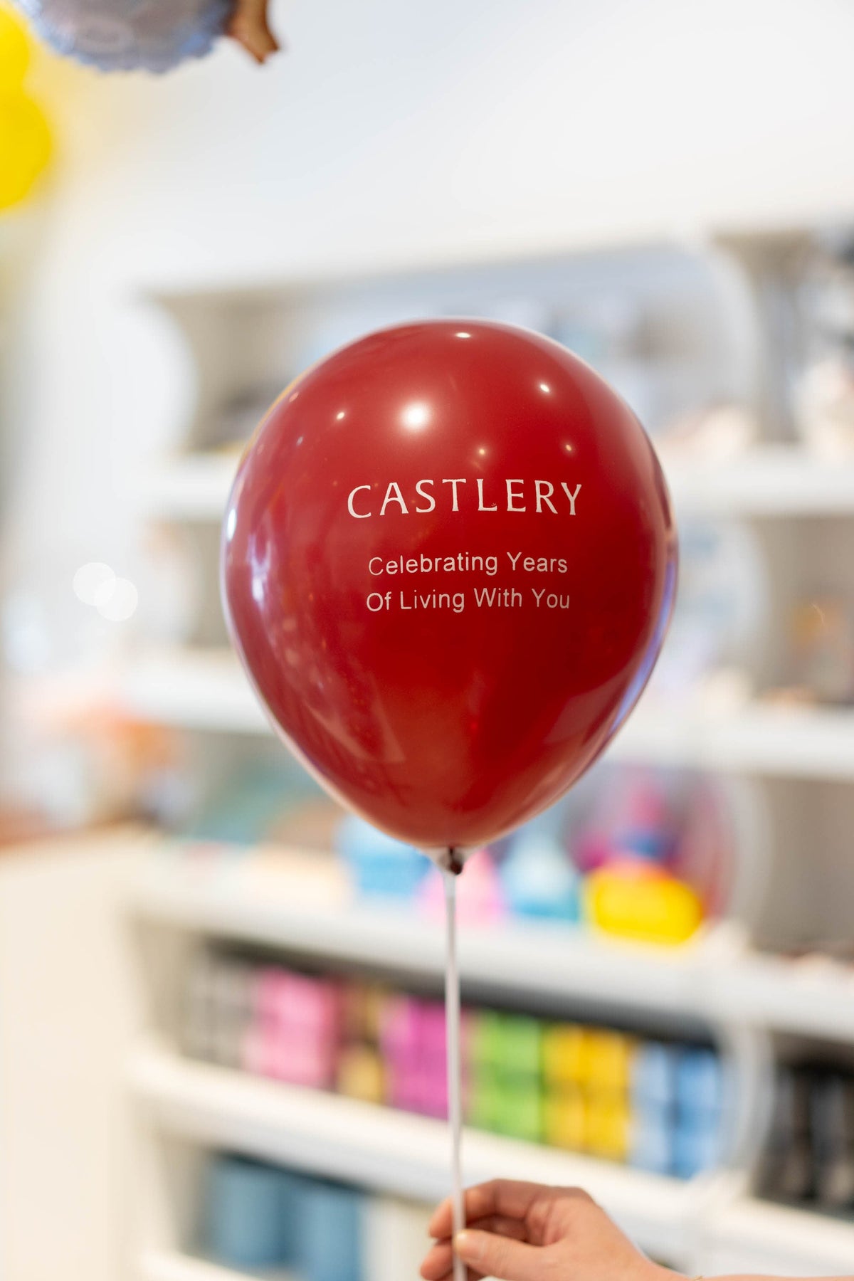 Custom printed balloon on a stick prepared by Happy Balloons for a business event