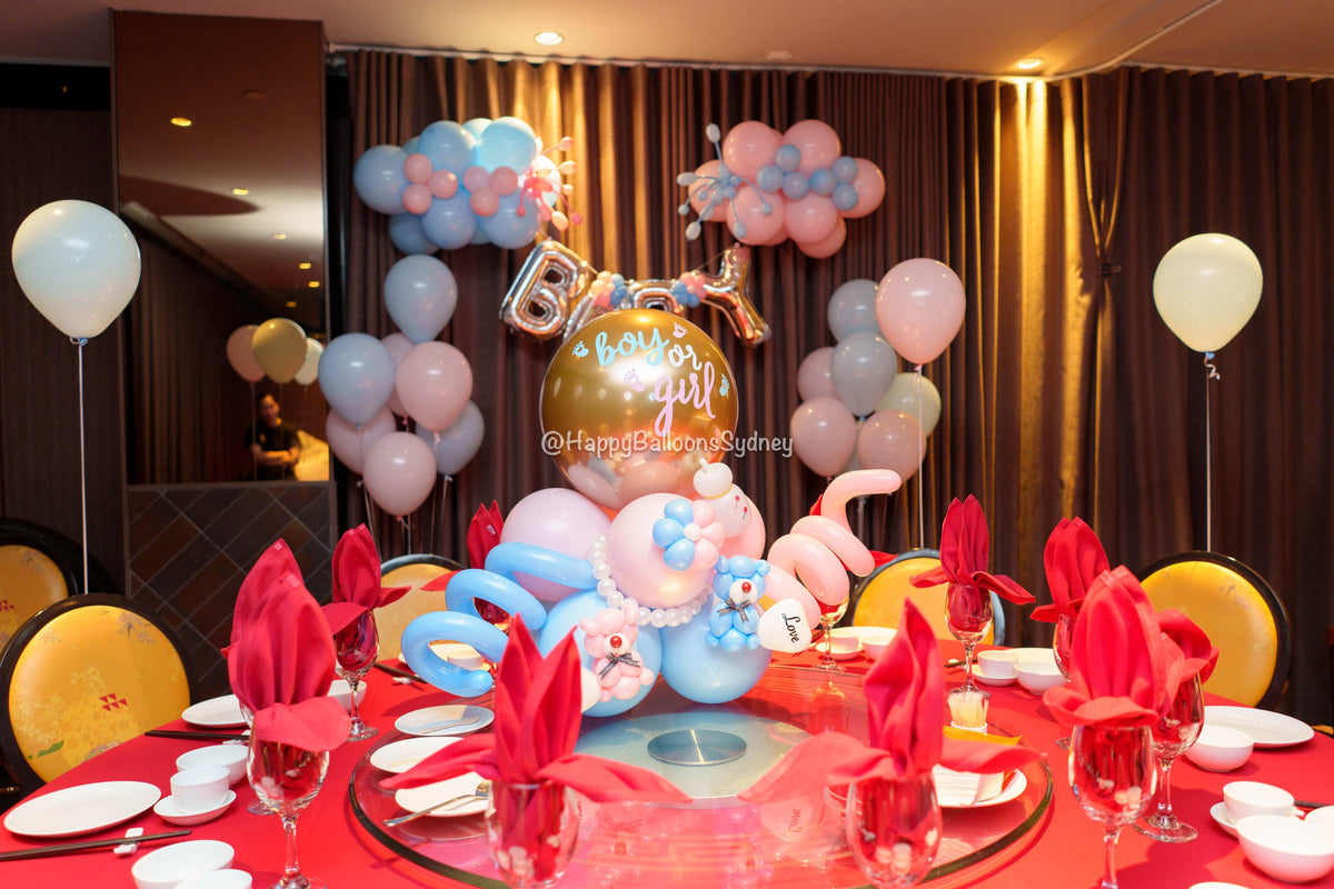 Pink-and-blue gender reveal backdrop with BABY foil lettering in a Sydney City Chinese restaurant