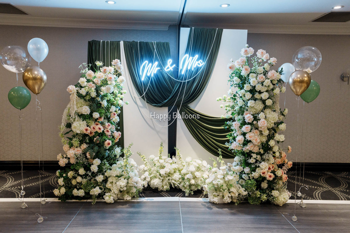 Wedding fabric backdrop and floral balloon arrangement