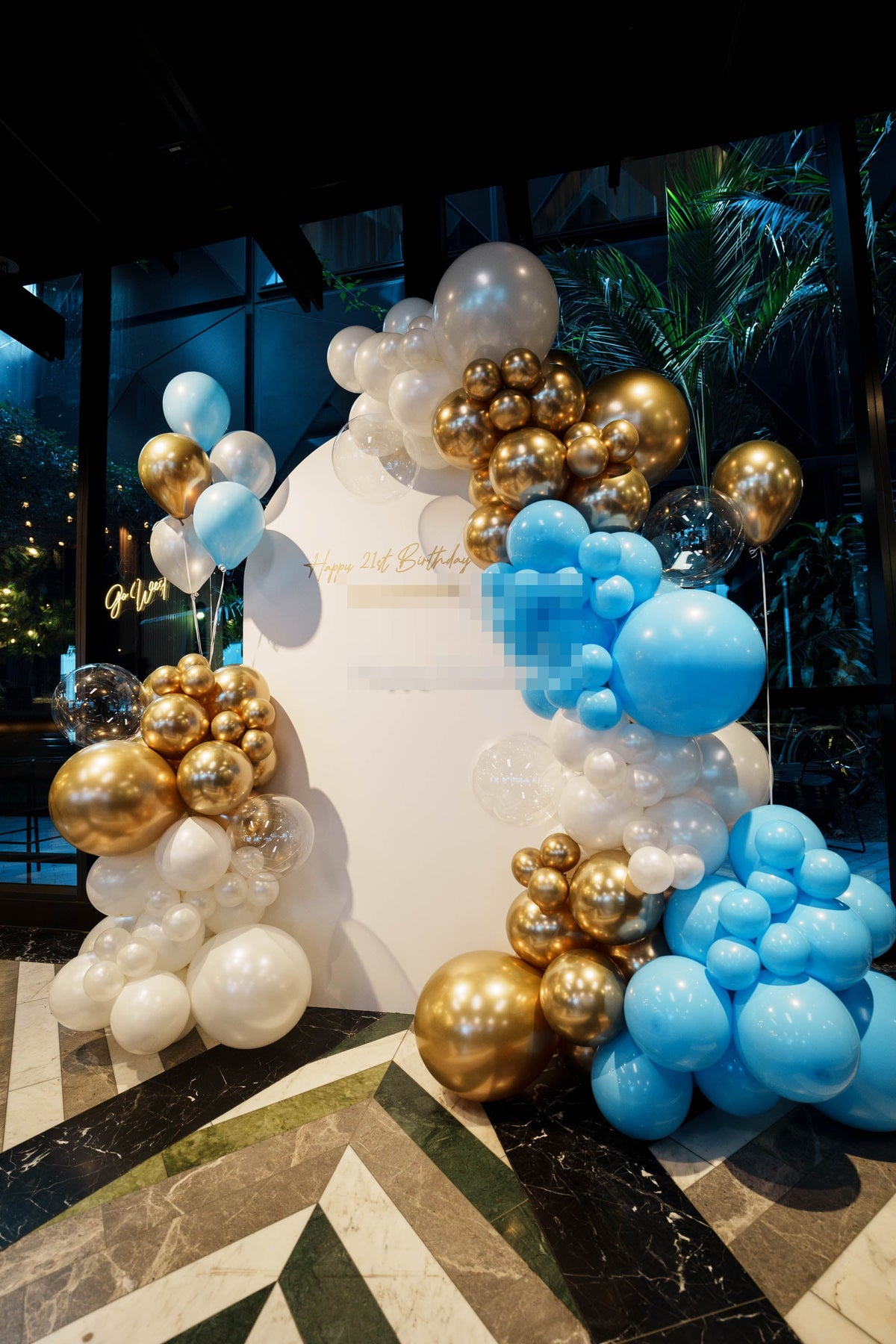21st birthday balloon backdrop detail in blue, gold and white